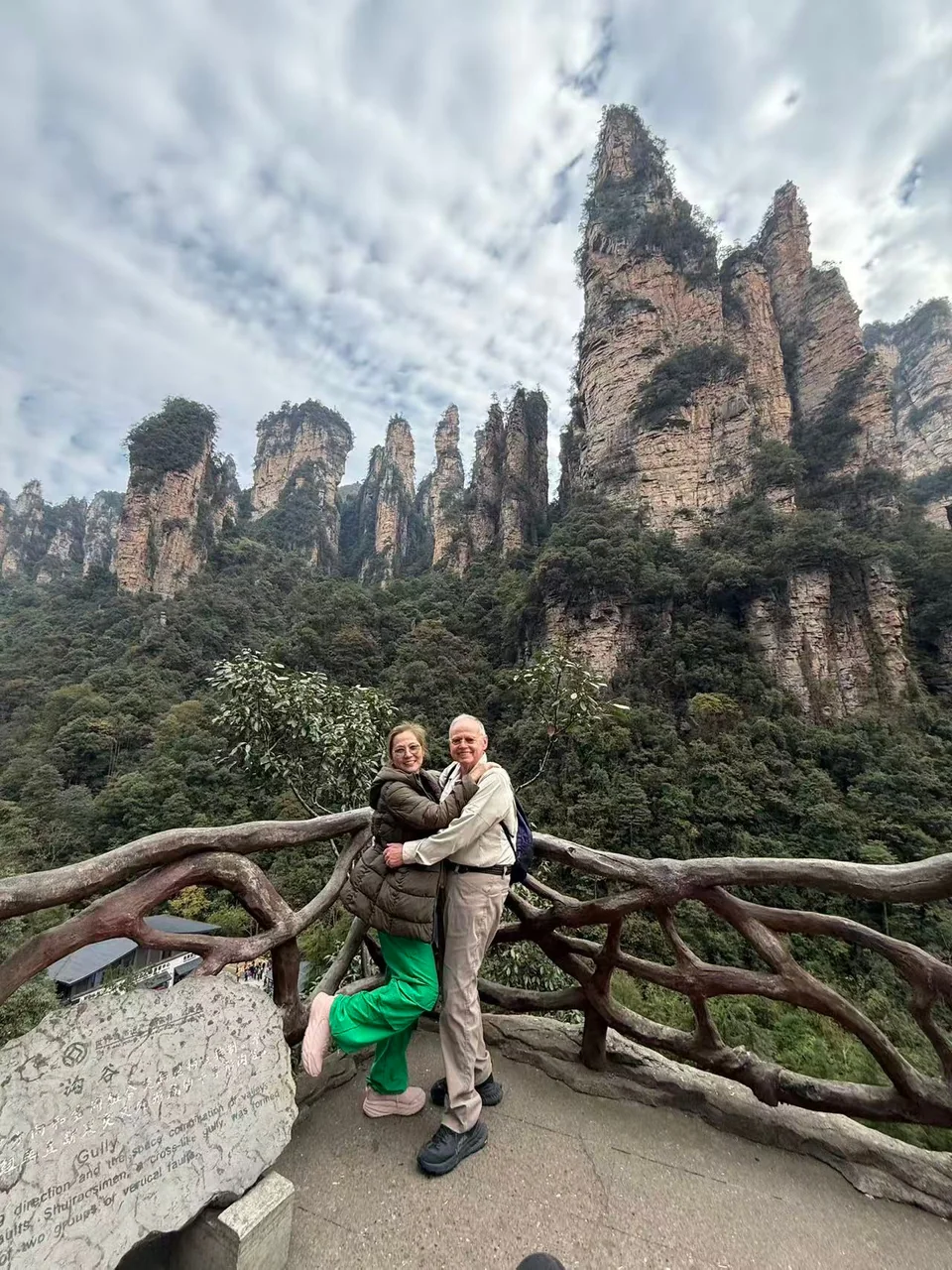 Elisabeth and James at a sandstone-peak overlook in Zhangjiajie · 张家界